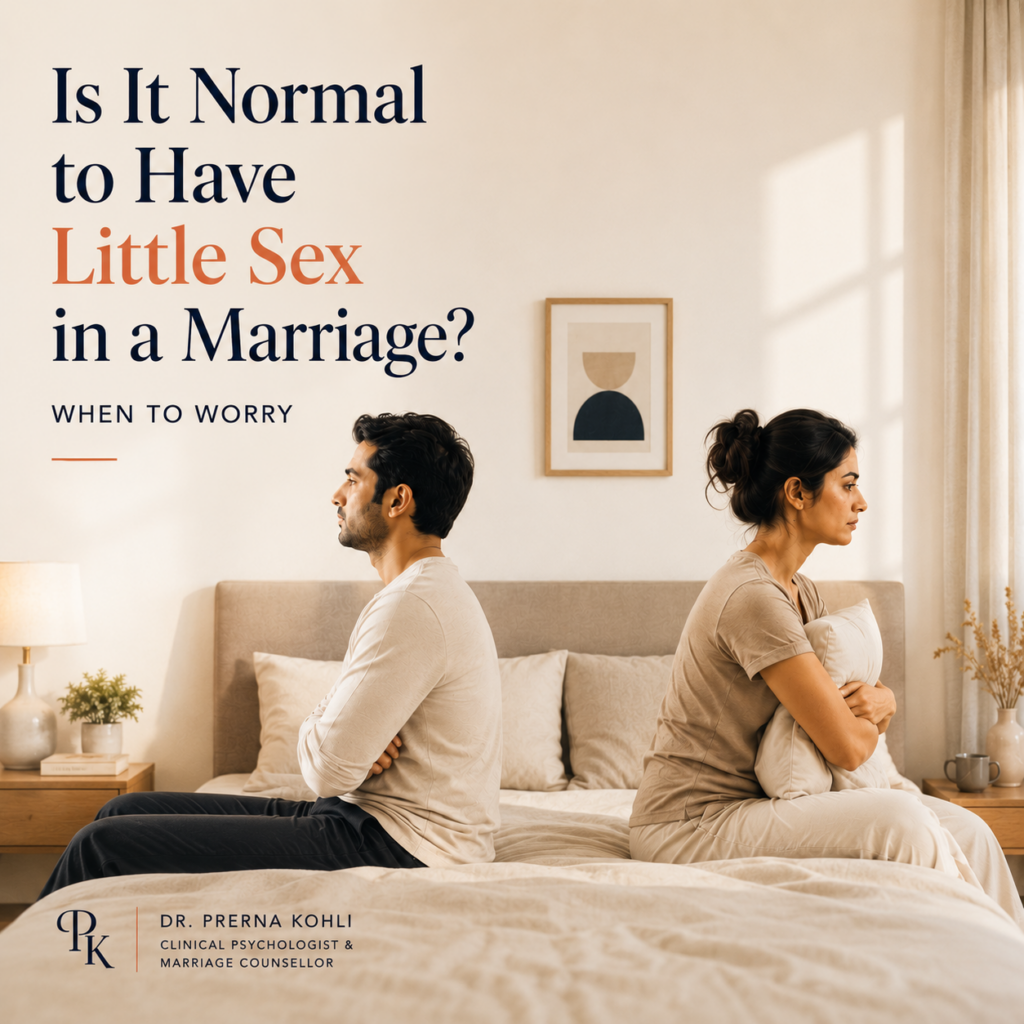 Married Indian couple sitting apart on a bed, illustrating differences in sexual desire, intimacy needs, and emotional connection within a marriage.