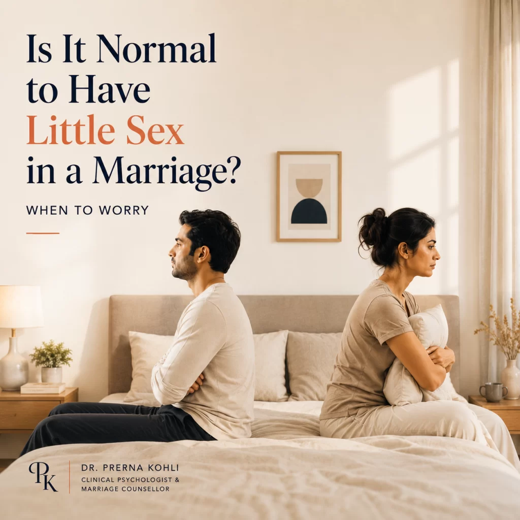 Married Indian couple sitting apart on a bed, illustrating differences in sexual desire, intimacy needs, and emotional connection within a marriage.