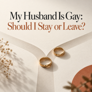 Two separated gold wedding rings on diverging paths, symbolising a wife's decision to stay or leave after discovering her husband is gay. Marriage counselling guidance by psychologist Dr. Prerna Kohli.